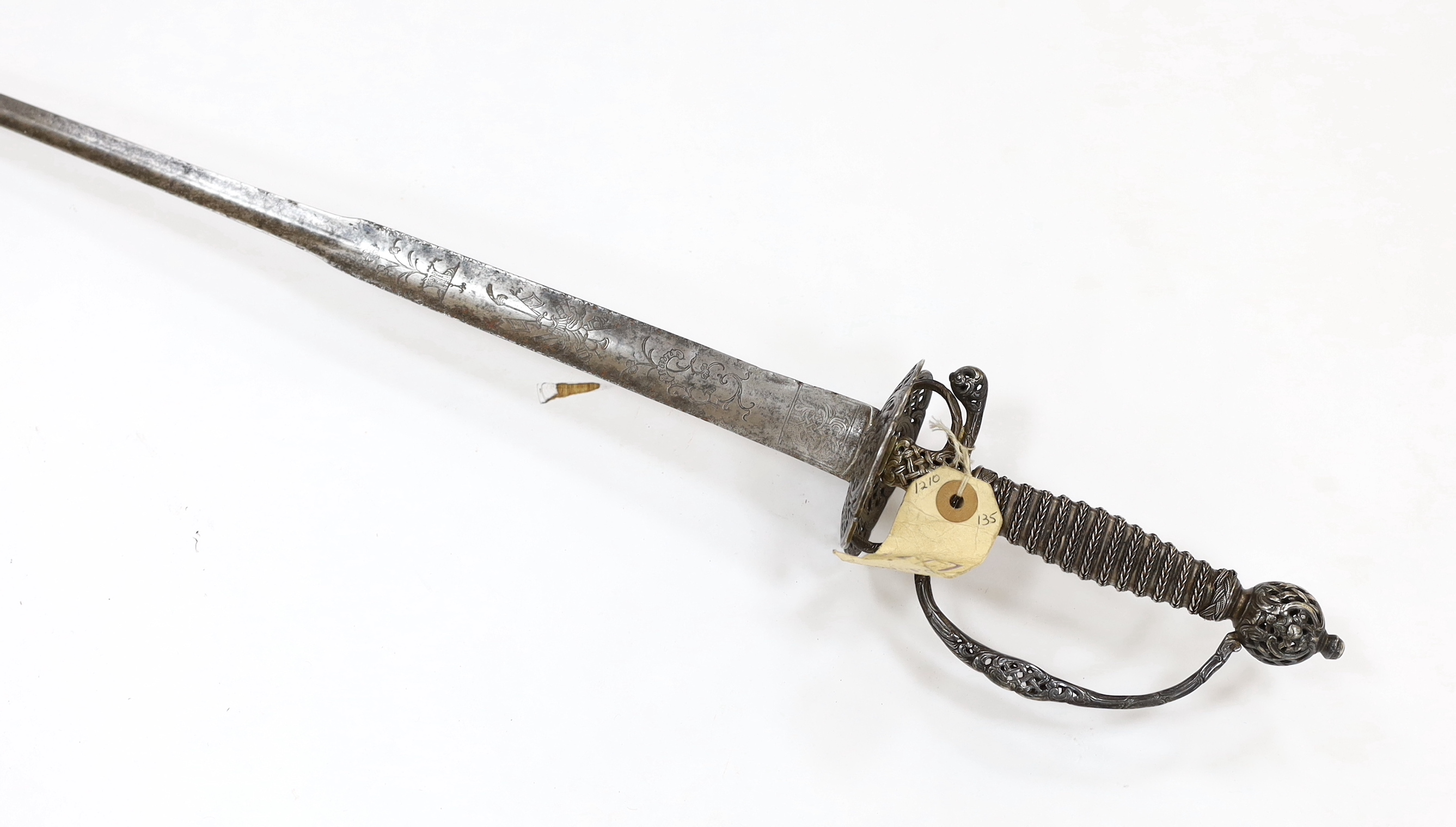 A French silver hilted small sword, c.1770, the ricasso rings have two tiny marks struck on the end which possibly could be Paris discharge marks, the hilt pierced with basketweave decoration and flowers, silver wire and